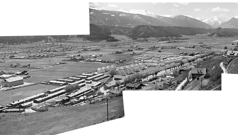 In der Höttinger Au wohnten nach 1945 viele Flüchtlinge im sogenannten „Ausländerlager.“ Dahinter erkennt man die Neubauten „Am Gießen“ und die „Heilig-Jahr-Siedlung“.